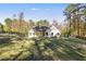 White house with covered patio and expansive backyard at 728 Harmony Rd, Temple, GA 30179