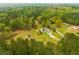 Aerial view showcasing the property nestled amidst lush greenery at 3119 E Fairview Rd, Mcdonough, GA 30252