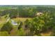Panoramic aerial view of the property enveloped by verdant trees at 3119 E Fairview Rd, Mcdonough, GA 30252