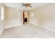 Spacious carpeted bedroom featuring a ceiling fan and a walk-in closet at 3119 E Fairview Rd, Mcdonough, GA 30252