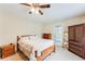 Bright bedroom with wood furniture, neutral walls, and ceiling fan at 3119 E Fairview Rd, Mcdonough, GA 30252