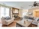 Inviting living room features a brick fireplace and mantle decorated with art and mementos at 3119 E Fairview Rd, Mcdonough, GA 30252