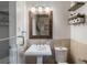 Clean bathroom with pedestal sink, toilet, and framed mirror at 331 Lakemoore Ne Dr # C, Atlanta, GA 30342