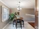 Bright breakfast nook with modern light fixture and plantation shutters at 331 Lakemoore Ne Dr # C, Atlanta, GA 30342