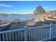 Scenic view of lakefront property with a private pier at 65 Kansas St, Temple, GA 30179