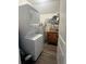 Laundry room with stackable washer and dryer at 65 Kansas St, Temple, GA 30179