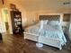 Large main bedroom with king-size bed and built-in shelving at 65 Kansas St, Temple, GA 30179