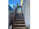 Wooden stairs leading to a lakefront deck at 65 Kansas St, Temple, GA 30179