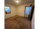 Bedroom with window unit, closet, and door to outside at 103 Dogwood Ln, Auburn, GA 30011