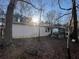 Back of house showing a white single story home with porch at 103 Dogwood Ln, Auburn, GA 30011