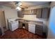 Kitchen with brown cabinets, white appliances and wood-look floors at 103 Dogwood Ln, Auburn, GA 30011