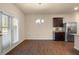 Bright dining area with hardwood floors and access to the backyard at 116 Centennial Ridge Dr, Acworth, GA 30102