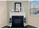 Living room features a gas fireplace with a modern white mantel at 116 Centennial Ridge Dr, Acworth, GA 30102