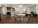 Open concept kitchen and dining area with island, modern appliances, and hardwood floors at 116 Centennial Ridge Dr, Acworth, GA 30102