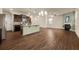 Open concept living room and kitchen with hardwood floors and high ceilings at 116 Centennial Ridge Dr, Acworth, GA 30102
