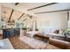 Open concept living room with vaulted ceiling, L-shaped sofa, and kitchen island at 127 Robinhood Dr, Woodstock, GA 30188