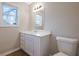 Clean bathroom with white vanity and vinyl flooring at 6110 Dorsett St, Douglasville, GA 30134