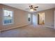 Spacious bedroom with ceiling fan and carpet flooring at 6110 Dorsett St, Douglasville, GA 30134