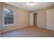 Bright bedroom featuring a large window and closet at 6110 Dorsett St, Douglasville, GA 30134