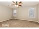 Spacious bedroom with neutral carpeting and a ceiling fan at 6110 Dorsett St, Douglasville, GA 30134