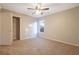 Bedroom with window, closet, and ceiling fan at 6110 Dorsett St, Douglasville, GA 30134