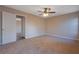 Simple bedroom with ceiling fan and carpet flooring at 6110 Dorsett St, Douglasville, GA 30134