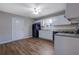 Kitchen with white cabinets, stainless steel appliances, and hardwood floors at 6110 Dorsett St, Douglasville, GA 30134