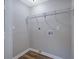 Bright laundry room with wire shelving and vinyl flooring at 6110 Dorsett St, Douglasville, GA 30134