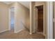 Upstairs hallway with carpet and access to bedrooms at 6110 Dorsett St, Douglasville, GA 30134