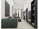 Spacious living room with green sofa, large TV, and stylish decor at 6305 Shannon Pkwy # 201, Union City, GA 30291