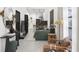 Open concept living room and kitchen with green sofa and ample natural light at 6305 Shannon Pkwy # 201, Union City, GA 30291