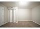 Finished basement with carpeted floors, neutral walls, and a double door closet at 6520 Chickasaw Dr, Douglasville, GA 30135