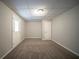 Finished basement featuring carpeted floors and neutral colored walls at 6520 Chickasaw Dr, Douglasville, GA 30135