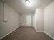 Finished basement with carpet, neutral walls, and closet at 6520 Chickasaw Dr, Douglasville, GA 30135