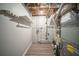 Utility area with exposed ceiling and ductwork, containing the HVAC and utility connections at 6520 Chickasaw Dr, Douglasville, GA 30135