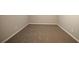 Basement with carpeting, painted walls, and white trim at 6520 Chickasaw Dr, Douglasville, GA 30135