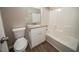Bathroom featuring a single sink vanity with modern fixtures, toilet, and a shower-tub combo at 6520 Chickasaw Dr, Douglasville, GA 30135