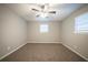 Neutral bedroom showcasing plush carpet, and natural light at 6520 Chickasaw Dr, Douglasville, GA 30135