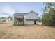 The backyard has a wood deck and a well maintained lawn at 100 Arthurs Ln, Covington, GA 30016