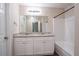 Bathroom with dual sinks and white cabinetry at 100 Arthurs Ln, Covington, GA 30016