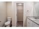 Bathroom with a toilet and a sink near a closet at 100 Arthurs Ln, Covington, GA 30016