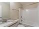 Bright bathroom with granite-topped vanity and shower-tub combination at 100 Arthurs Ln, Covington, GA 30016