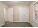 Bedroom with closet and access to bathroom at 100 Arthurs Ln, Covington, GA 30016