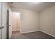 Neutral bedroom with carpet, closet, and ensuite access at 100 Arthurs Ln, Covington, GA 30016