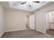 Bright bedroom with an ensuite bathroom and walk-in closet at 100 Arthurs Ln, Covington, GA 30016