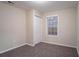 Bedroom featuring a closet and a window at 100 Arthurs Ln, Covington, GA 30016