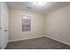 Cozy bedroom featuring a window and a closet at 100 Arthurs Ln, Covington, GA 30016