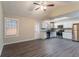 Bright kitchen with stainless appliances, white cabinets, granite counters, wood floors, and backyard access at 100 Arthurs Ln, Covington, GA 30016