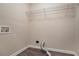 This laundry room features wood-look floors, neutral walls, and a wire rack at 100 Arthurs Ln, Covington, GA 30016