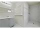 Modern bathroom with a shower and gray vanity at 1770 Lee St, Decatur, GA 30035